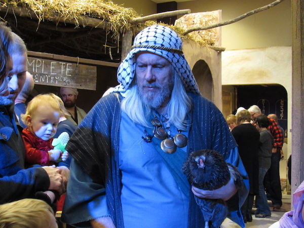 Guests Gathering Around One Of the Actors With Chicken In Bethlehem in 2017